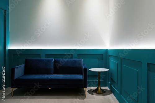 Modern Blue Sofa and Marble Table in Teal Room