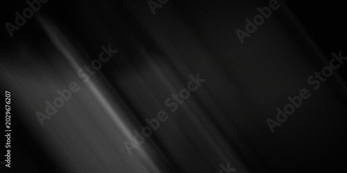 Obraz na plátně Dark and somber background with subtle diagonal light streaks and a fine grain texture creating a dramatic effect