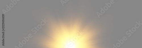 Golden sunburst rising from bottom center with soft radial light rays on dark grey background
