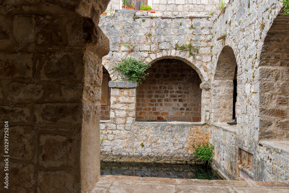 Fototapeta premium Historic Tvrdalj Castle Courtyard and Reflecting Pool in Stari Grad, Hvar Island, Croatia