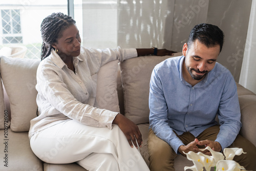 Woman offering support to man with mental health issues