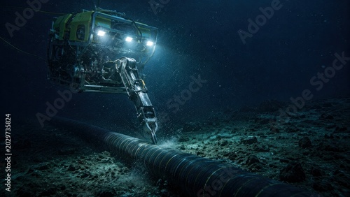 Underwater robotic vehicle operating on submarine cable in deep sea infrastructure maintenance and global communications repair concept.
