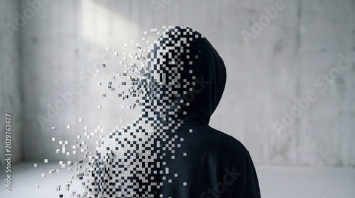 Foto Anonymous person in a black hoodie disintegrating into digital pixels, symbolizing data loss, cybersecurity