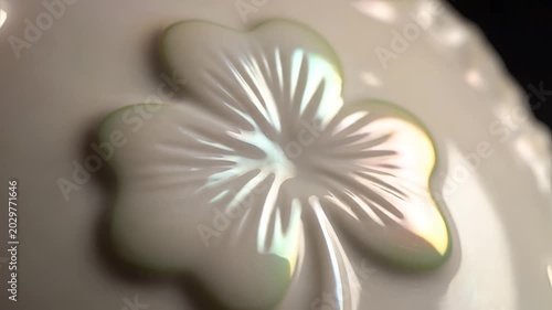 Closeup of a delicate embossed flower pattern on a textured surface.