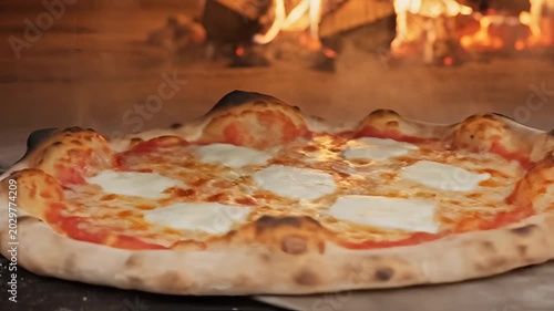 Delicious Pizza Baking in a Fiery WoodFired Oven CloseUp.