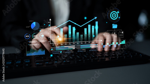 Schilderij op canvas Person interacting with digital data visualization interface, displaying graphs, charts, and statistics on a keyboard in a dark environment for business analysis Haptic