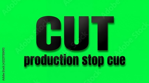 Black CUT text on bright green background, Production Stop Cue
