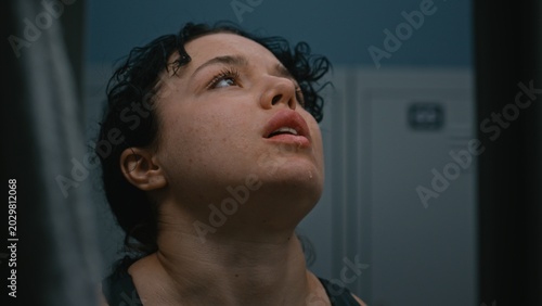 Bild auf Leinwand Close Up of Breathless and Covered in Sweat, Young Sporty Woman in Locker Room Recovering After Difficult Training Session