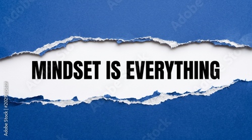 Mindset is everything message displayed on a torn blue paper strip revealing a clean white background area perfect for adding custom text or corporate branding