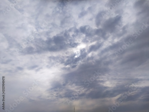 Fotografija Dense layered white and grey clouds filling the sky with soft diffused lighting creating calm and atmospheric natural scene