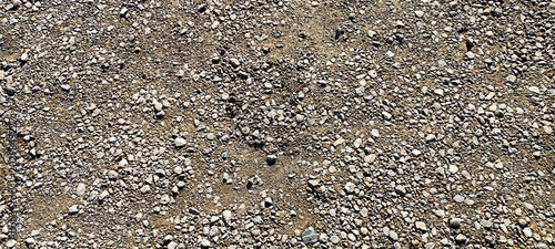 Quadro su tela Texture of rough gravel and coarse sand on the ground