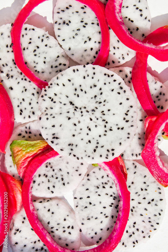 Vertical Close Up Dragon Fruit Flesh and Peel Slices