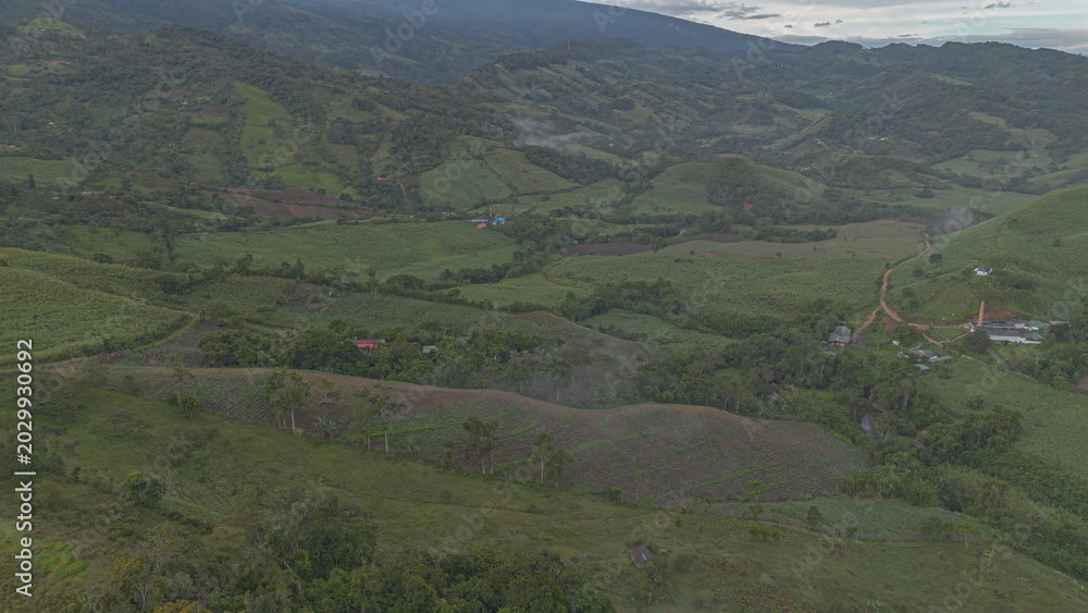 Naklejka premium Panoramic aerial view of panela crops and green mountains in Boyacá