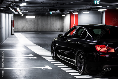 Luxury car parking in empty underground garage