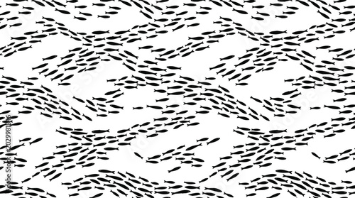 Fotografie Seamless pattern of small black fish silhouettes arranged in wavy schools on a w