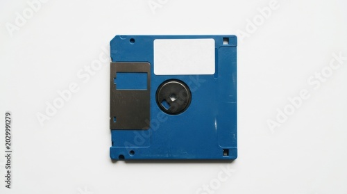 Floppy disk on a plain white background for retro technology and digital storage memory. Vintage computer diskette, obsolete data