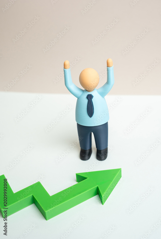 Φωτογραφία A businessman rejoices at the rising profits and successful financial growth