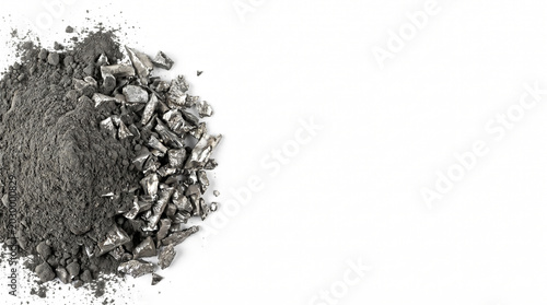 Fine dark grey lithium carbonate powder and metallic lithium scraps from battery recycling on the left of a white background with wide copy space