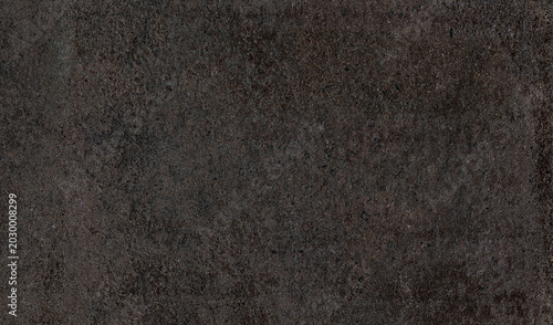 Quadro su tela A close-up abstract shot of a dark, textured surface, resembling rough-hewn stone or worn concrete