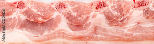 Pork ribs raw meat texture closeup isolated on white background, butcher cut food pattern