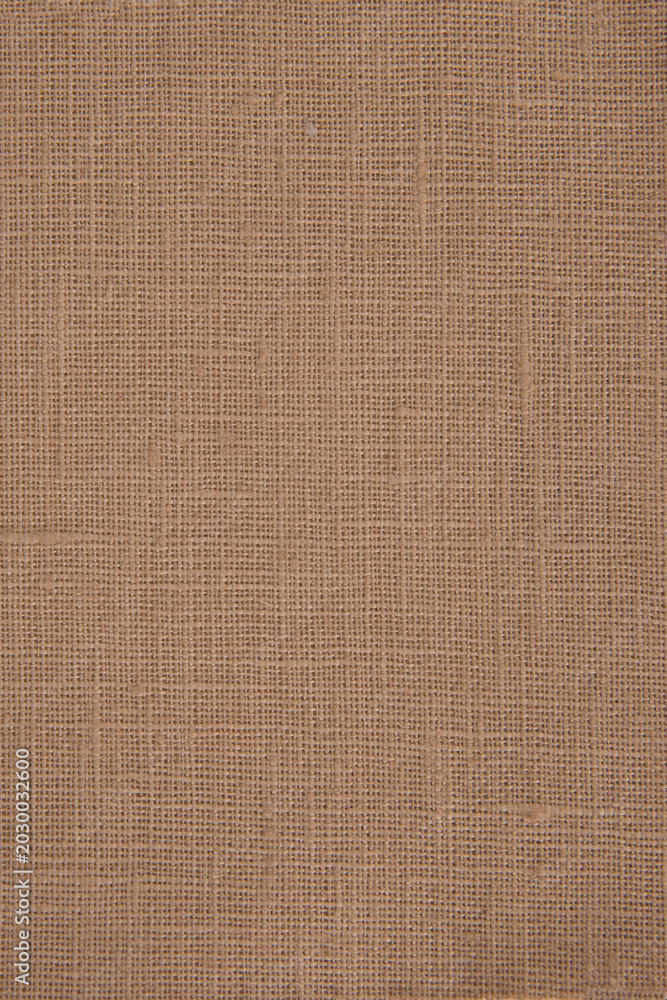 Fototapeta premium Seamless natural burlap fabric texture background with rustic woven linen pattern in warm brown tones.
