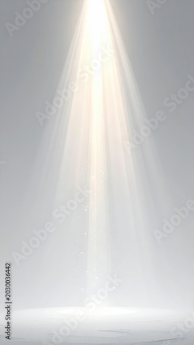 Bright golden light beam shines down from above on a soft, light grey surface