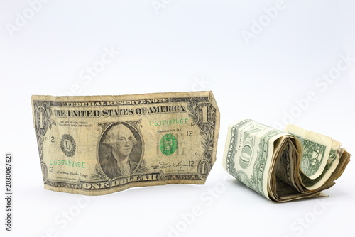 Photos Old torn faded dollar bills banknotes. White background.