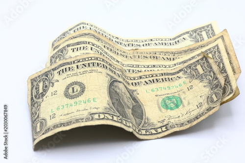 Photography Old torn faded dollar bills banknotes. White background.