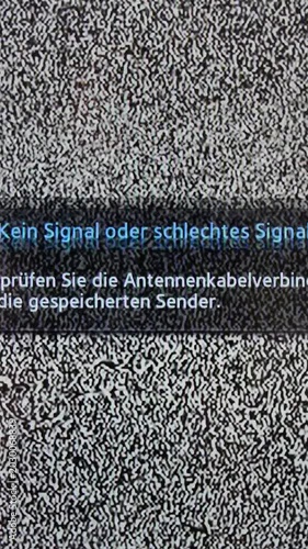 Analog static noise with German error text on television vertical