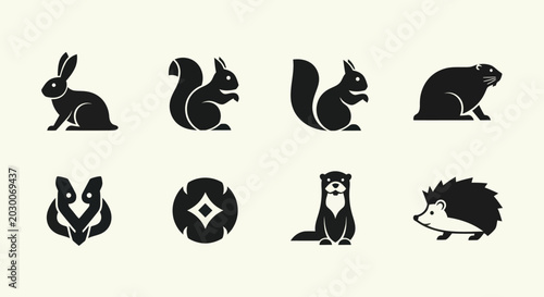 Photography Set of stylized animal icons and symbols, black silhouettes on a beige backgroun