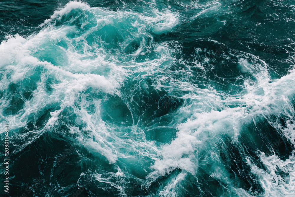 Fototapeta premium Dynamic Ocean Waves Crashing Against Rocky Shoreline, Combining Sea Foam and Raw Power with a Sense of Turbulent Beauty