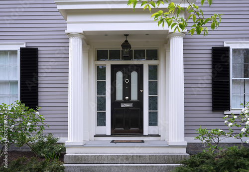 Fotografie Portico style entrance to clapboard home