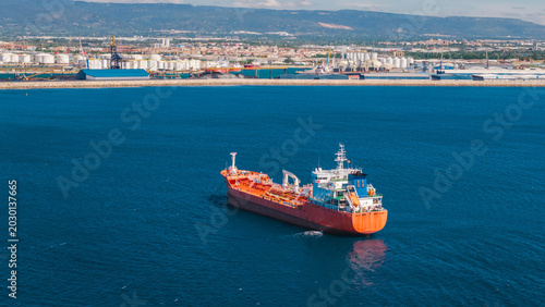 Bild auf Leinwand Aerial view of chemical tanker ship near industrial port coastline in Tarragona