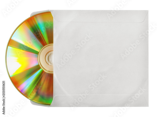 Fotografija Compact disc peeking out of a white sleeve. Isolated