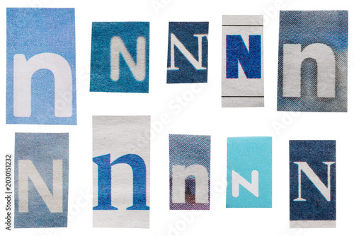 Fotografie Set of blue ransom letters N cut out from vintage newspapers and magazines isola