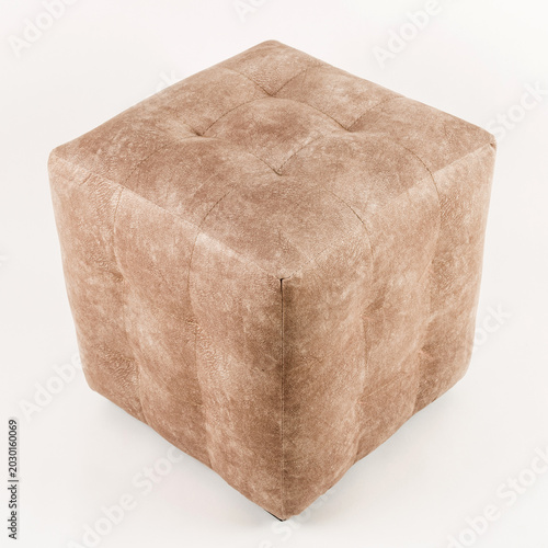 Fotografija Soft brown pouf on a white background.