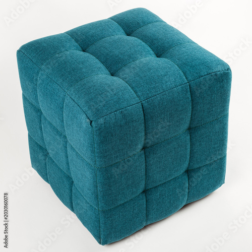 Canvastavla Soft blue pouf on a white background.