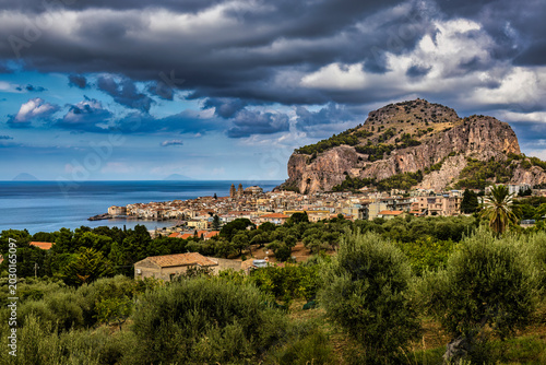 Tableau sur toile Cefalù coastal town beneath dramatic clouds, Sicily, Italy