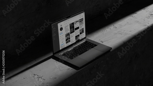 Sleek Laptop on Concrete with Dramatic Lighting
