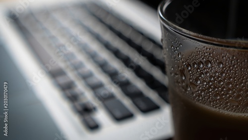 Condensation on Glass with Laptop and Coffee