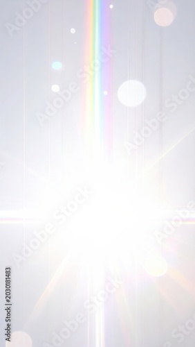 Bright sunburst with rainbow lens flare and bokeh on a soft, pale background