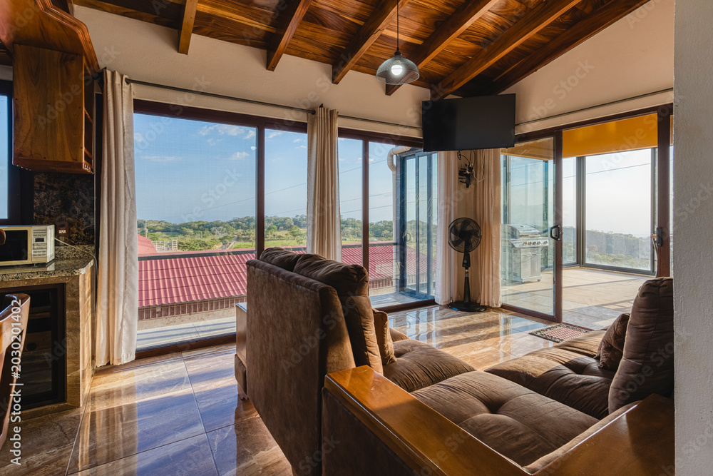 Φωτογραφία Modern living room interior with scenic view and sunlight