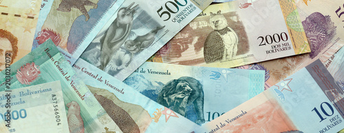 Photos Venezuelan bolivar money banknotes pile on table