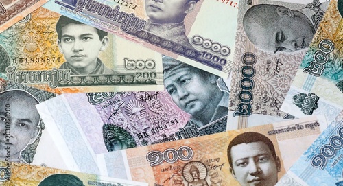 Billede på lærred Cambodian riel money bills in pile on table