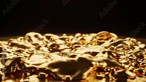Captivating close-up of dynamic liquid gold, showcasing its shimmering, rich texture and brilliant metallic surface, evoking concepts of wealth, luxury, and financial growth