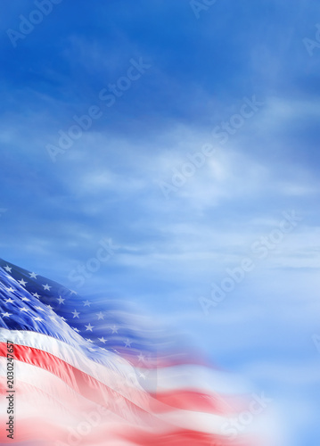 Close up blurred motion American flag in dramatic sky