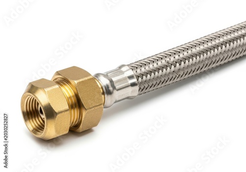A close-up view of a flexible stainless steel braided water supply line with a brass fitting