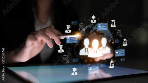 Obraz na plátne Futuristic Technology Concept Showing Data Connection and Networking Over a Tablet Device with Symbolic Human Figures and Globes