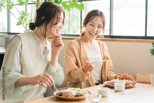 Photos Women enjoying a delicious lunch with their female friends/mom friends (girls' g