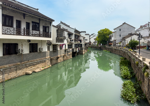Photography Waterway with traditional Chinese-style buildings on both sides at Luodian Old Town, dating back to Yuan Dynsty in Baoshan district, Shanghai, China